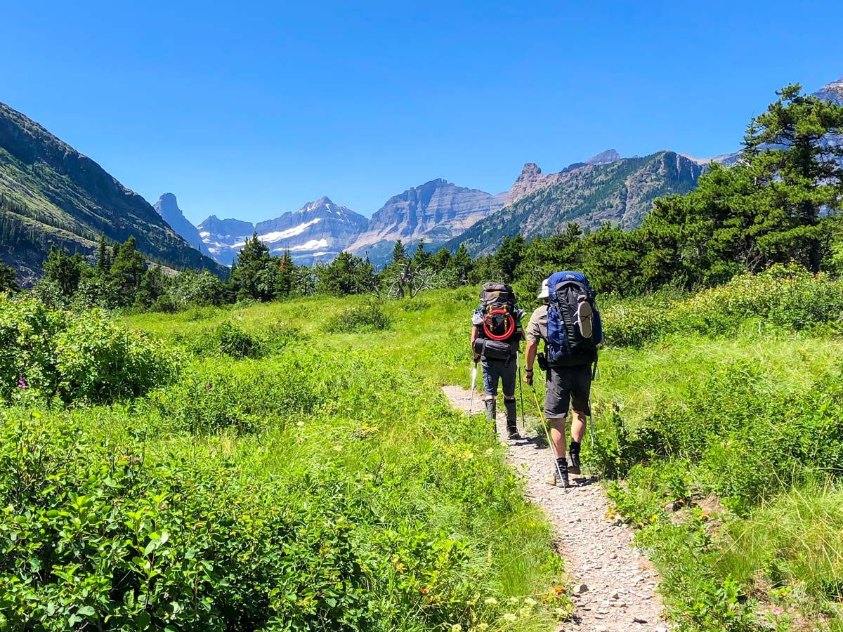 Couple backpacking on North Circle Backpacking Trail in Glacier National Park