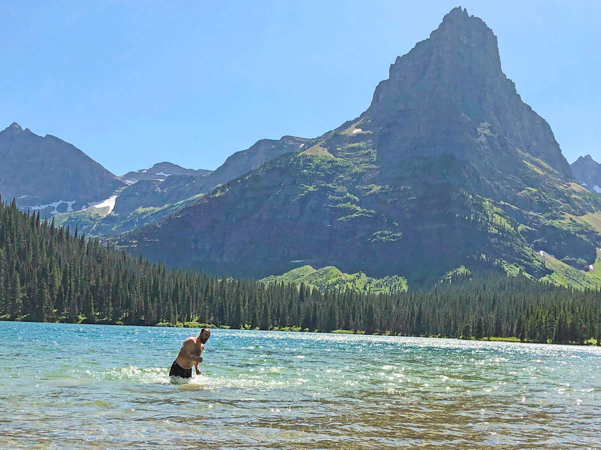 Swimming in the freezing water on North Circle Backpacking Trail in Glacier National Park