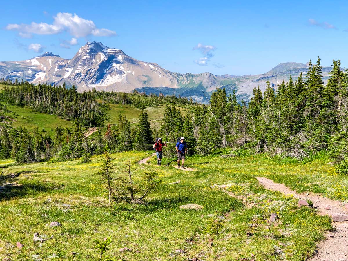 Two backpackers near Swiftcurrent pass on North Circle Backpacking Trail in Glacier National Park