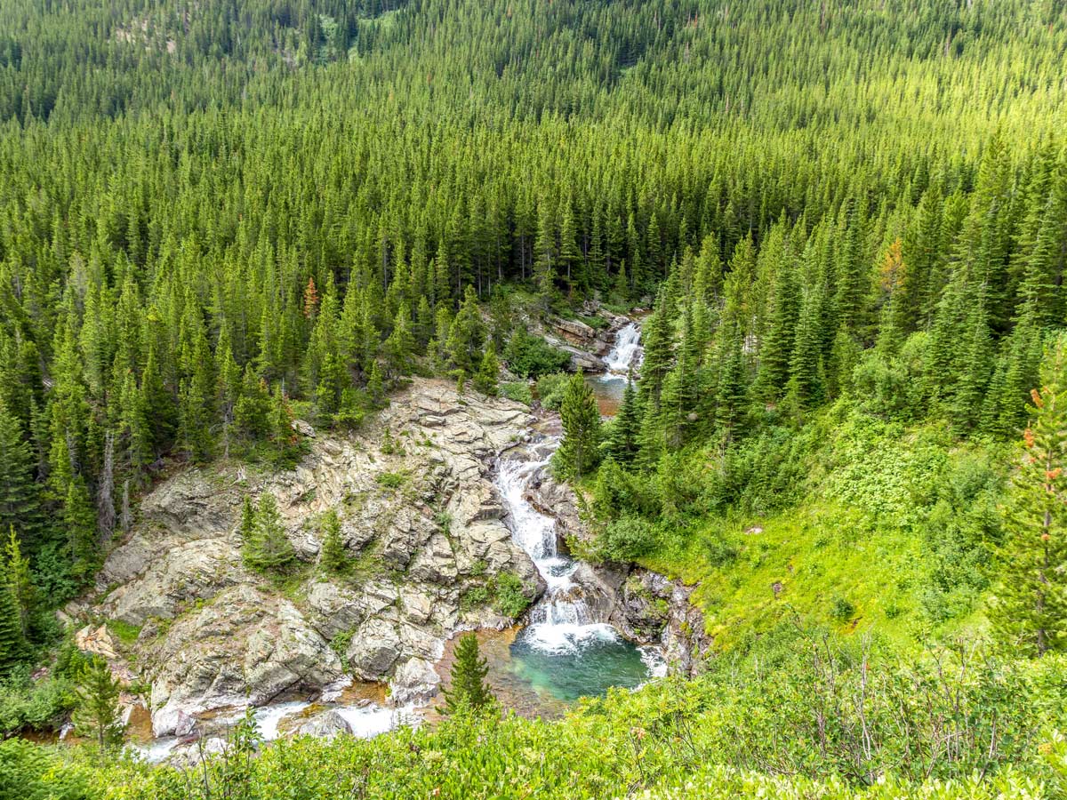 Waterfall on Pitamakan Dawson Loop Backpacking Trail in Glacier National Park