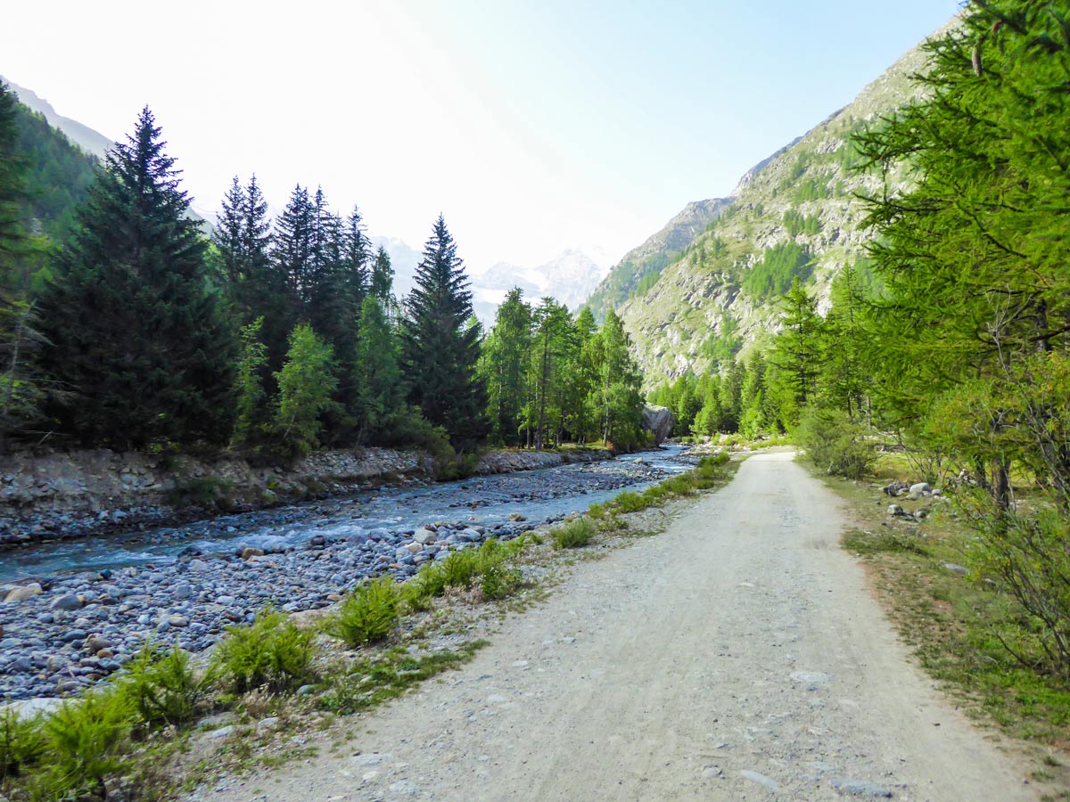 Wide path along Valnontey River on Alpe Money hike in Gran Paradiso National Park, Italy