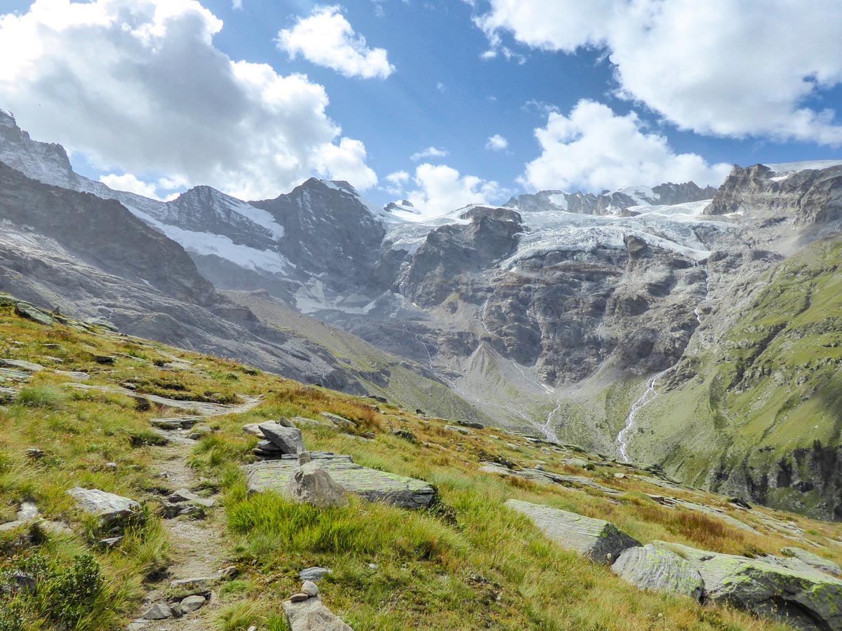 Slowly approaching beautiful Tribolazione Glacier on Alpe Money hike in Gran Paradiso National Park, Italy