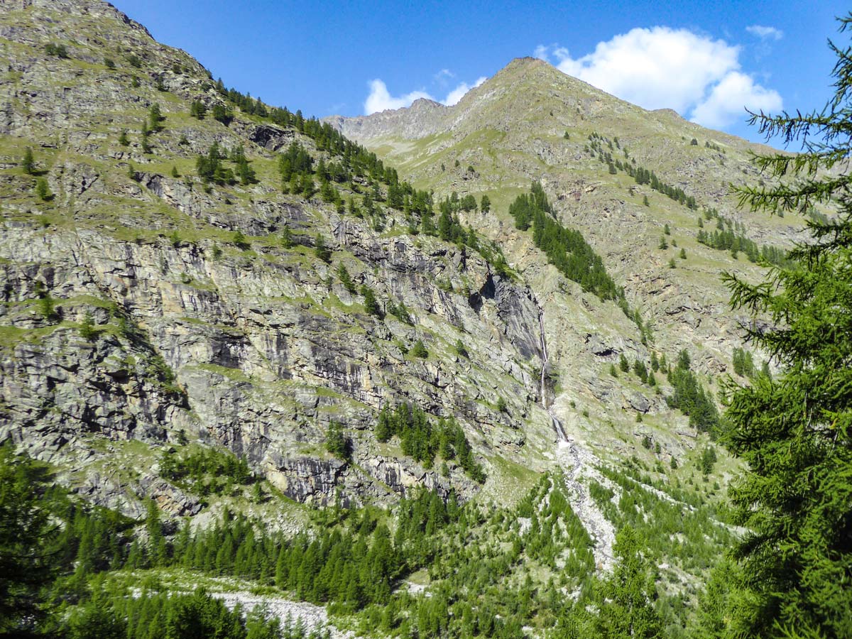 Lone small waterfall on Alpe Money hike in Gran Paradiso National Park, Italy