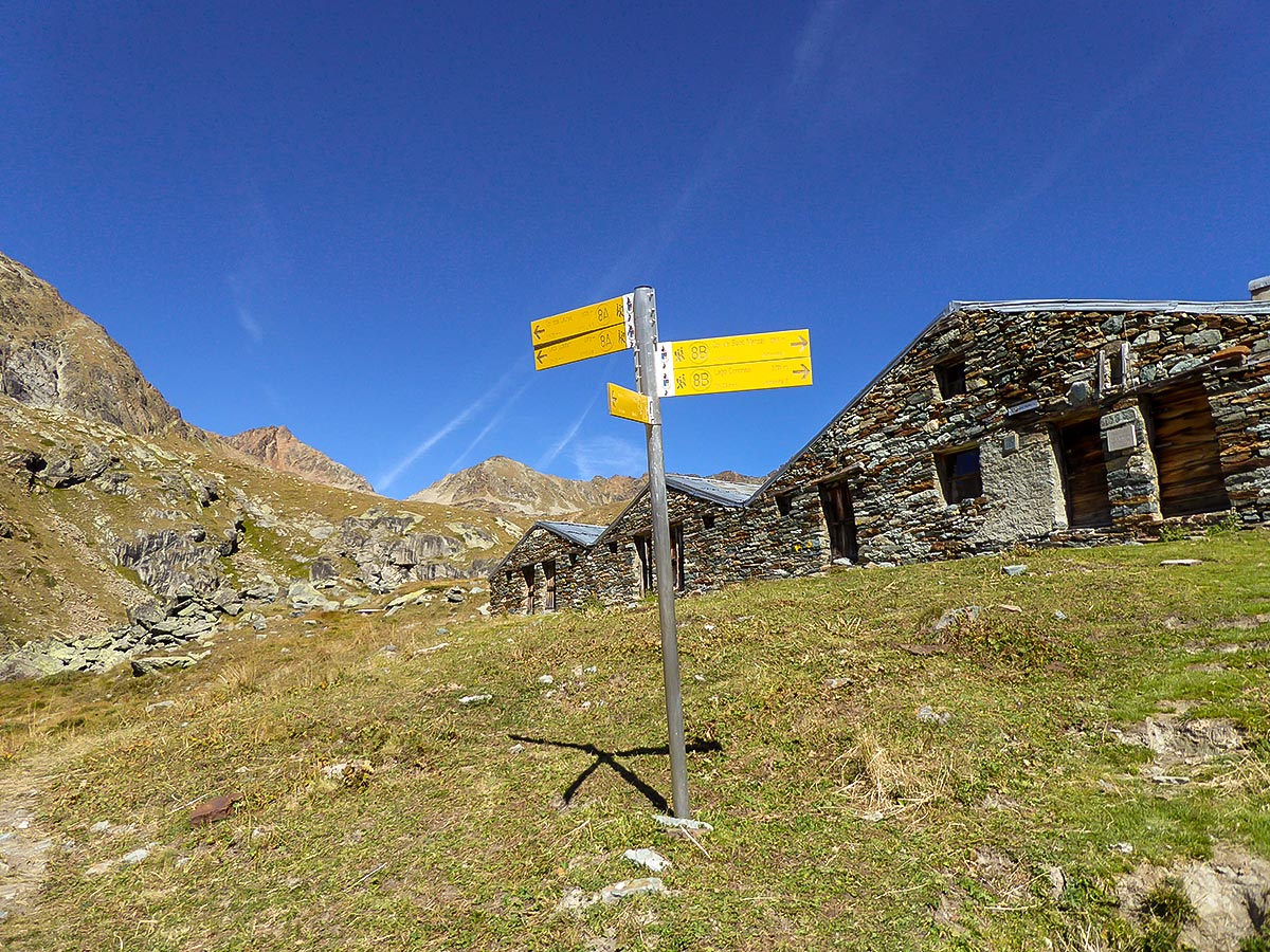 Signpost near Grauson Superiore on Col de Saint-Marcel hike in Gran Paradiso National Park, Italy