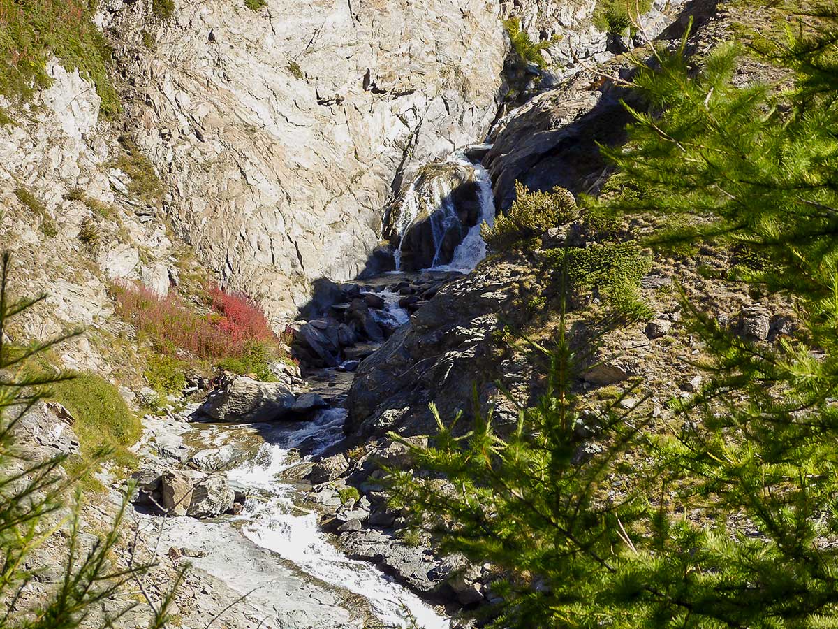 Beautiful waterfall on Col de Saint-Marcel hike in Gran Paradiso National Park, Italy