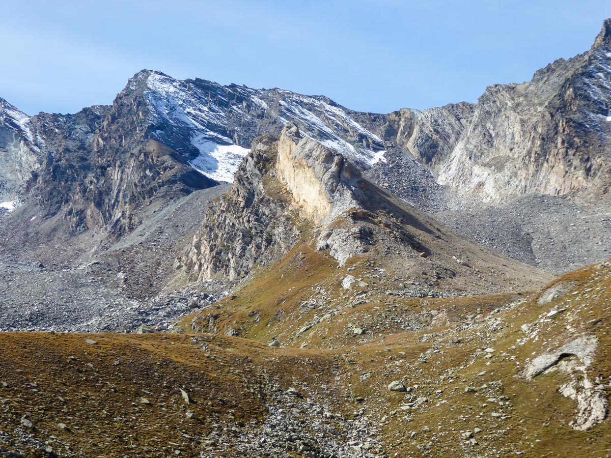 Beautiful peaks surrounding Alpe Lauson high valley on Colle della Rossa hike in Gran Paradiso National Park, Italy