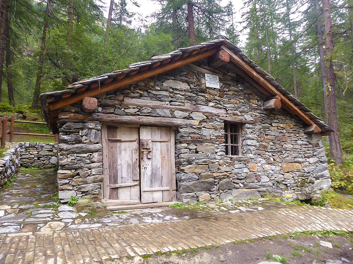 Old mill near Lago Pellaud on Lago Pellaud via the Grand Rû Ring hike near Gran Paradiso National Park, Italy
