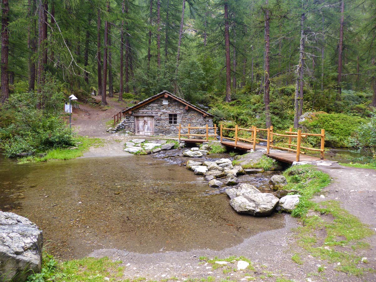 Old mill on Lago Pellaud via the Grand Rû Ring hike near Gran Paradiso National Park