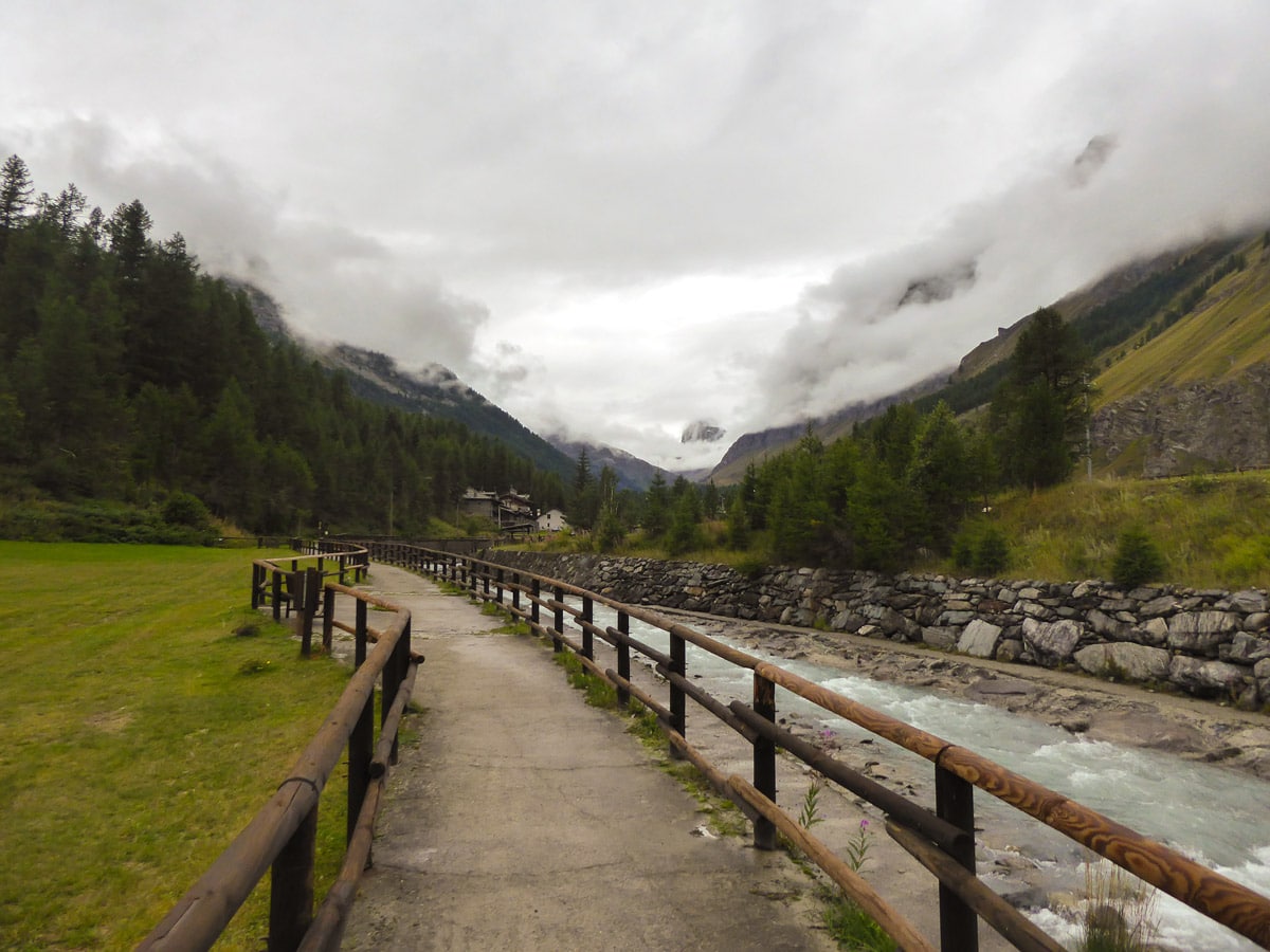 Path along the river on Lago Pellaud via the Grand Rû Ring hike near Gran Paradiso National Park, Italy