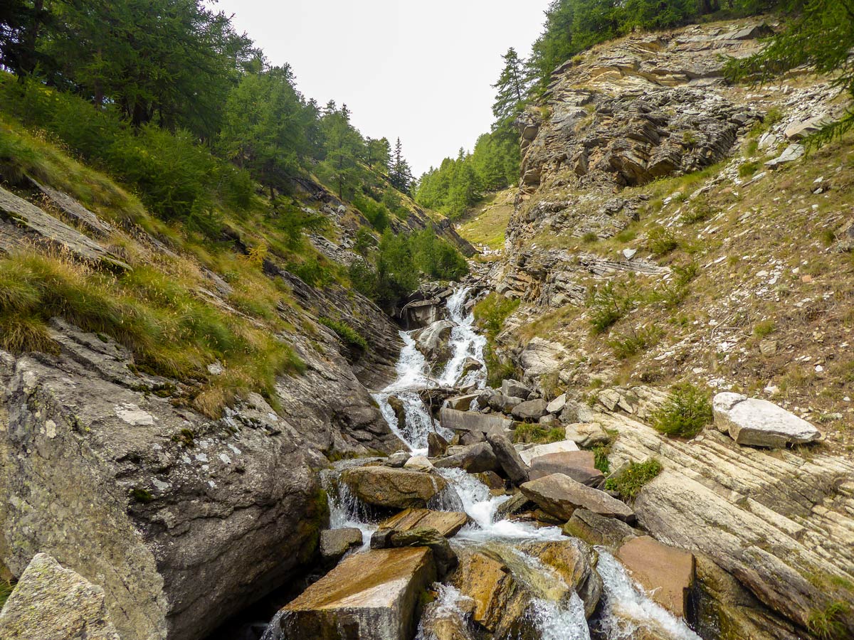 Wild stream along the trail of Rifugio Vittorio Sella hike in Gran Paradiso National Park, Italy