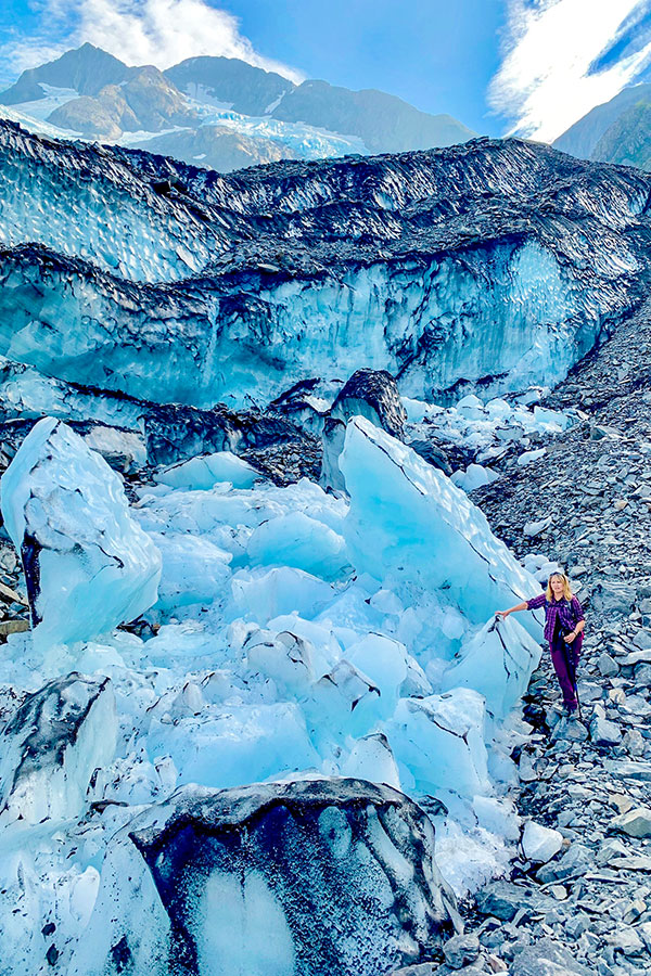 Hiker and ice formation comparison on Byron Glacier Trail in Alaska