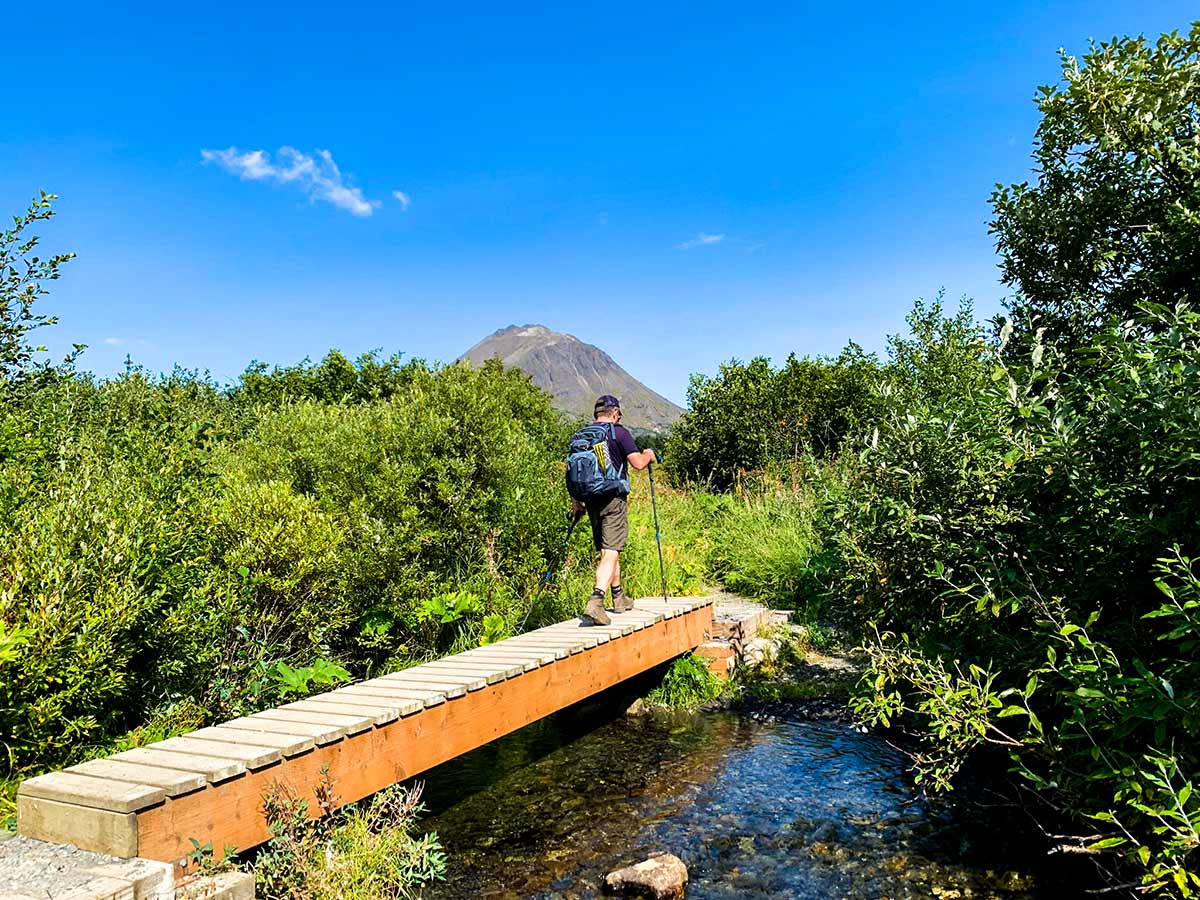 Crossing the bridge on Carter and Crescent Lakes Trail in Alaska