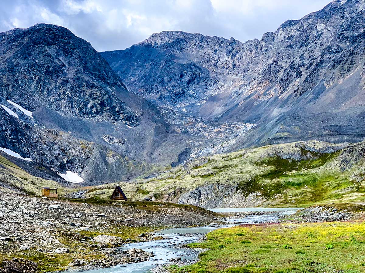 Crow Pass Cabin Crystal Lake and beautiful surrounding mountains of Alaska