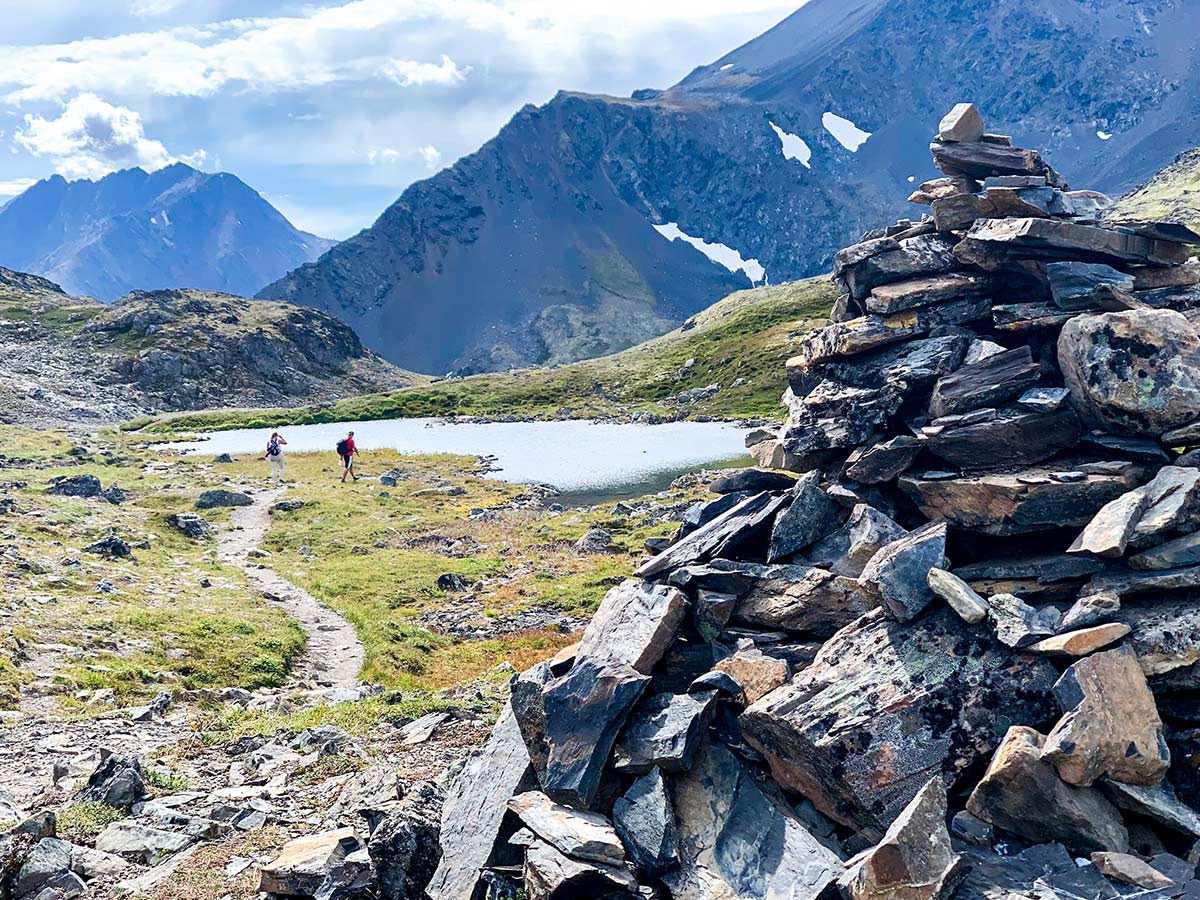 Cairn and nameless tarn near Crow Pass Trail in Chugach State Park Alaska