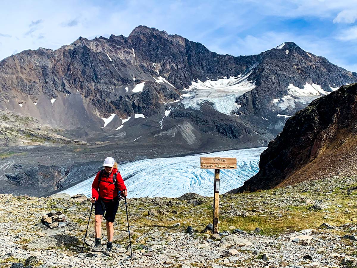 Hiker near Crow Pass with the view to Raven Glacier in Chugach State Park Alaska