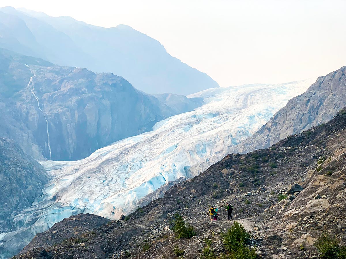 Group of hikers approaching Exit Glacier on a hike in Alaska