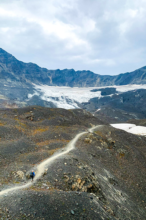 Hikers on a trail to Harding Icefield in Alaska