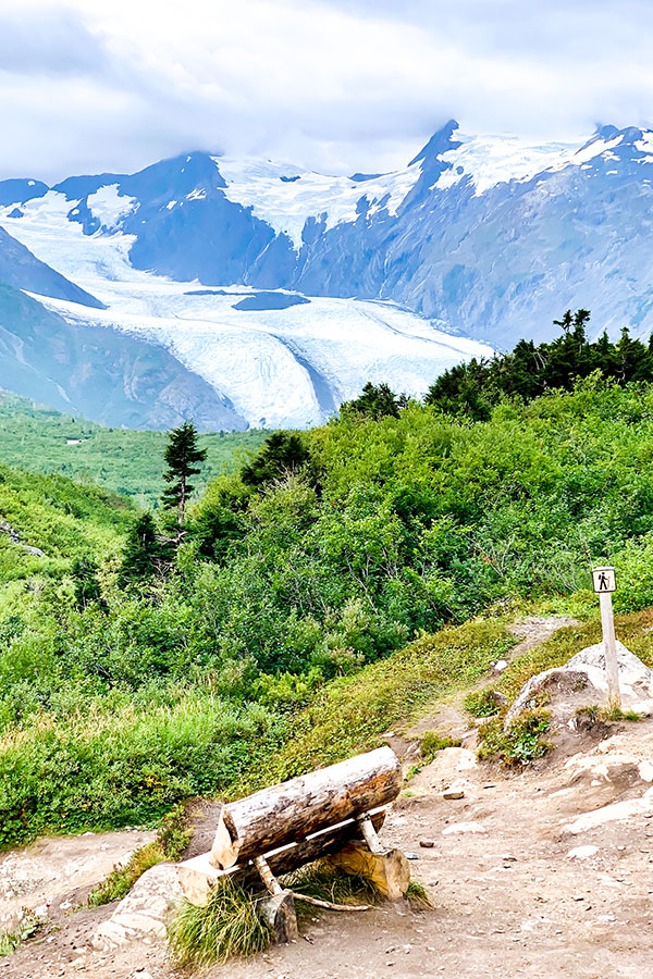 Bench with beautiful views of area surrounding Portage Lake on a hike in Alaska