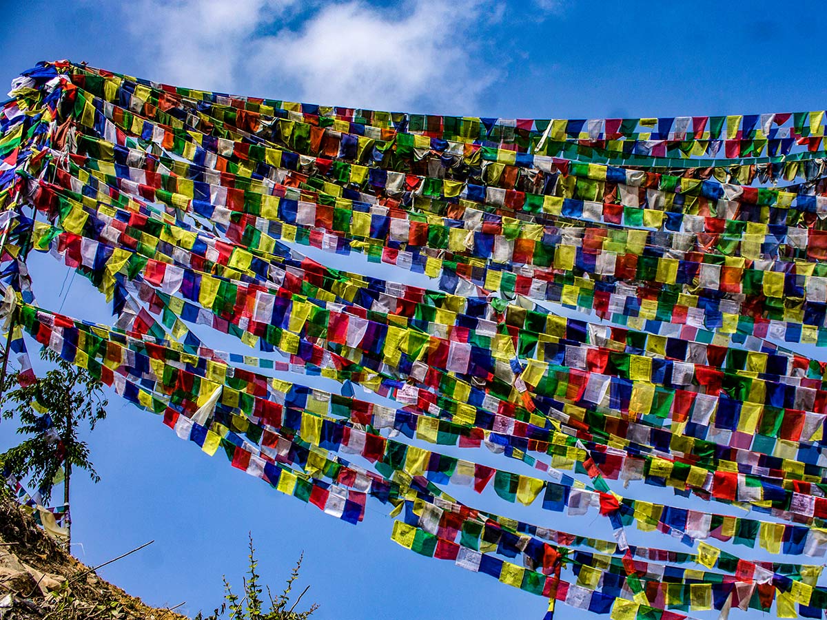 Tons of prayer flags fluttering in the top of Namobuddha Gumba