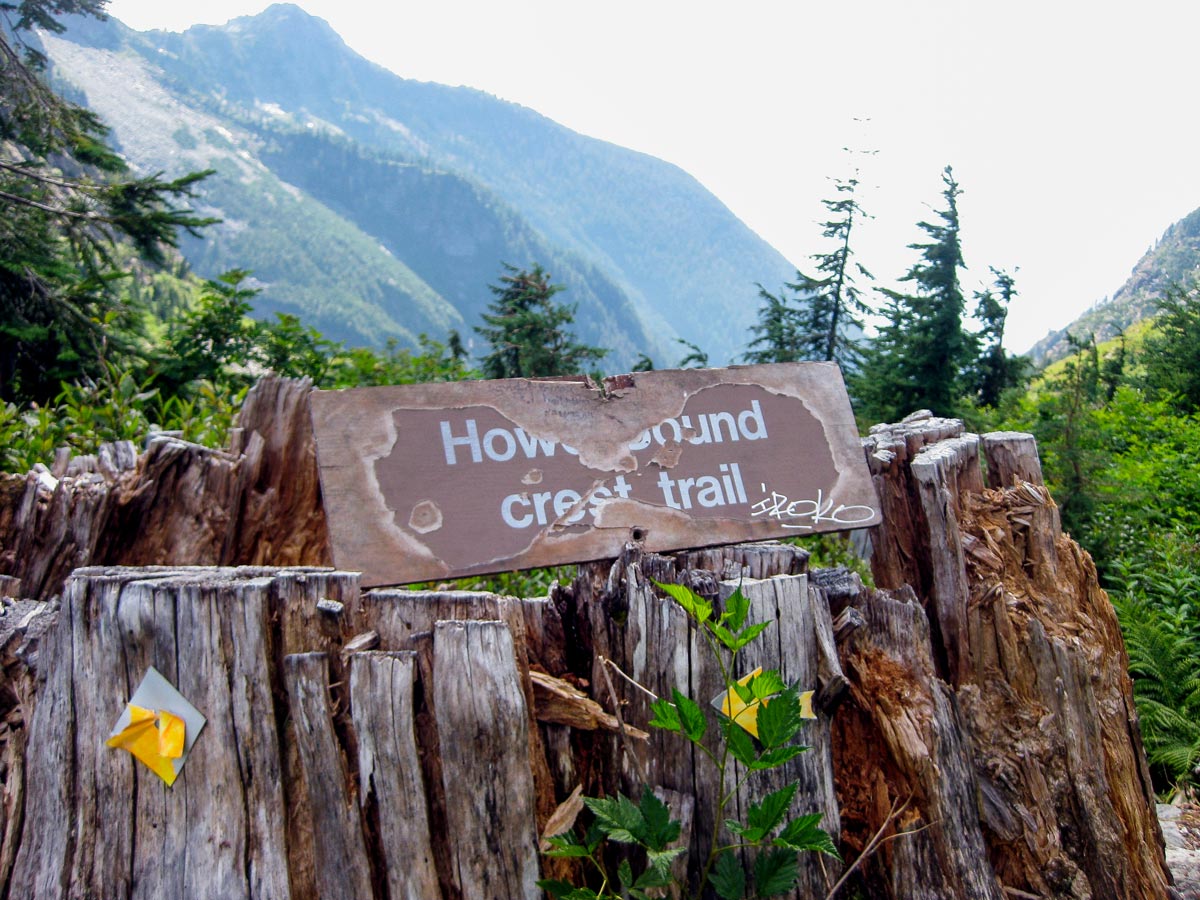 Old Howe Sound Crest sign along hiking trail through North Shore region of west coast British Columbia