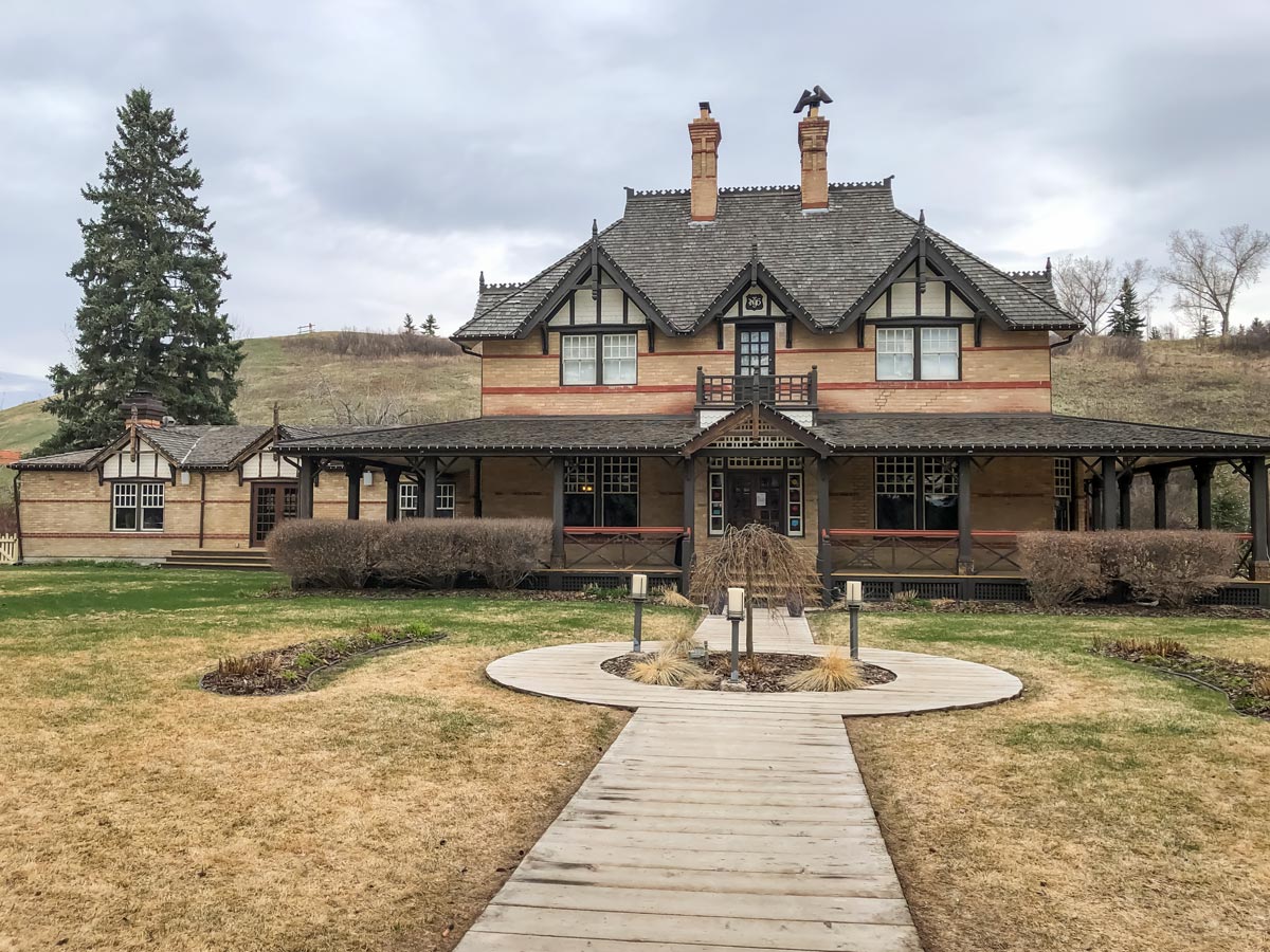 Walking by historic Heritage house along Fish Creek Ranch and Parkland Ridge walking trails in Calgary Alberta