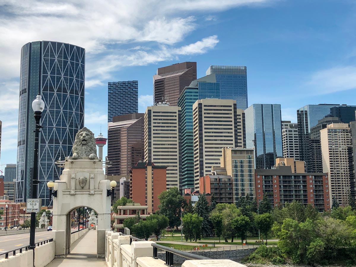 Downtown Calgary viewed from bridge crossing Bow River along walking path