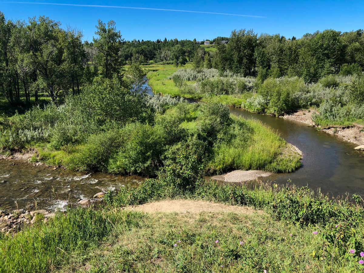 Beautiful meadering river along Fish Creek Ranch and Parkland Ridge walking trails in Calgary Alberta