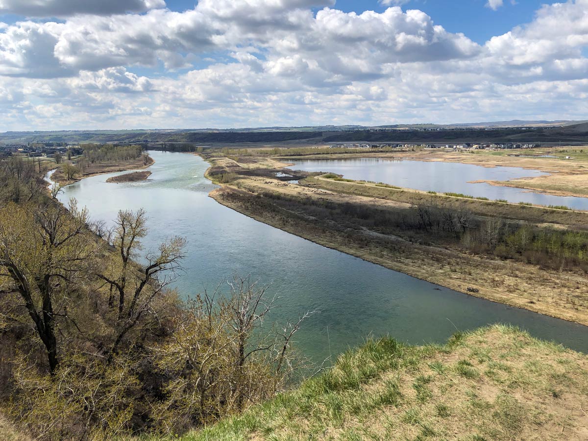 Beautiful turquoise river seen along Cranston Ridge walking paths in Calgary Alberta