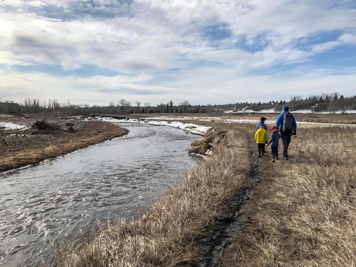 Family walk along Fish Creek Ranch and Parkland Ridge walking trails in Calgary Alberta