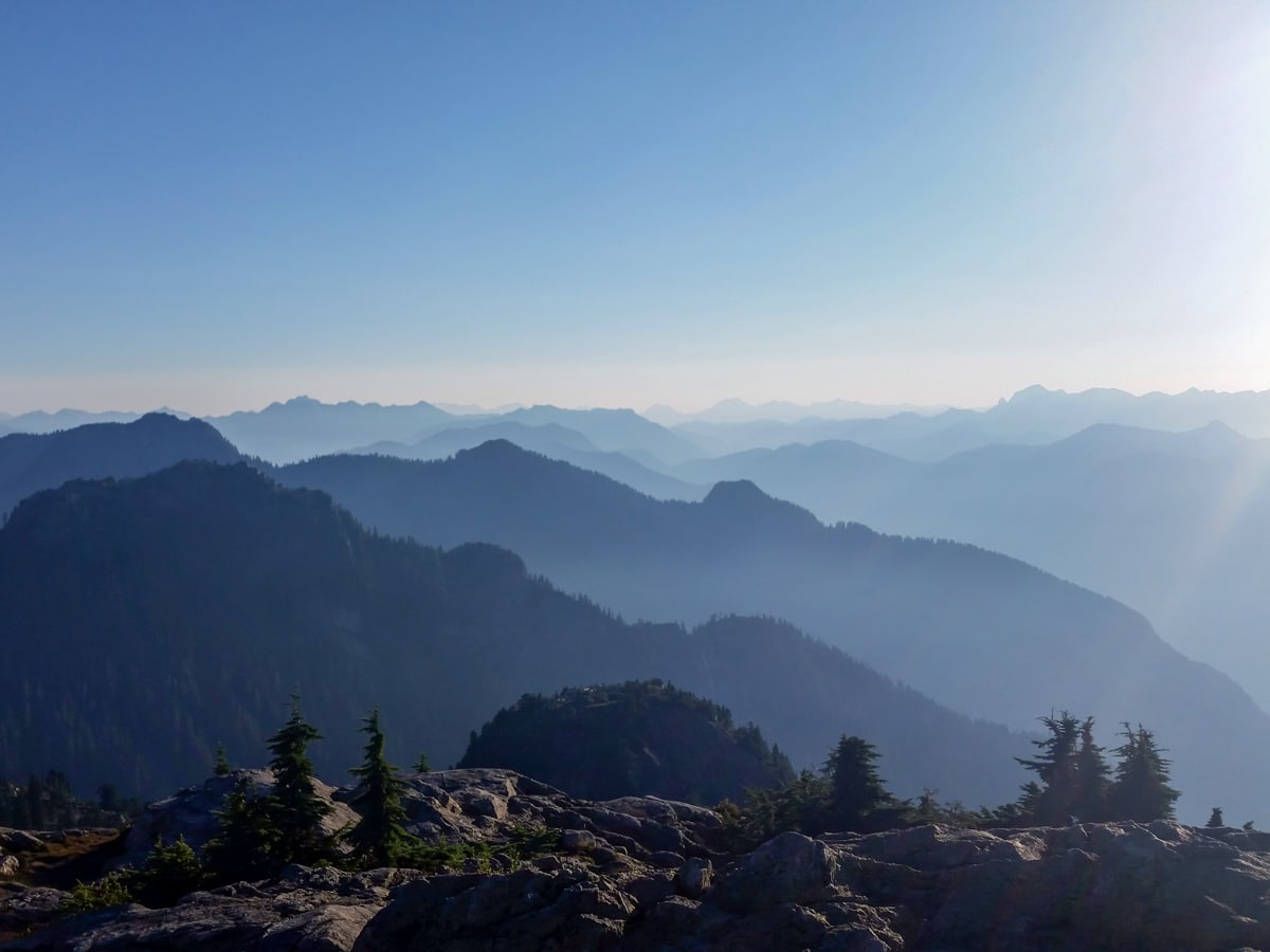 Hazy Canadian mountains viewed from Mount Seymour hike in North Share region of BC