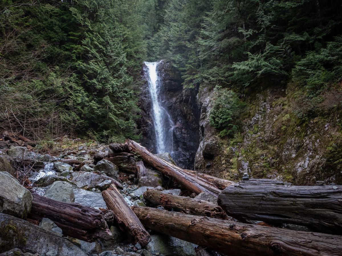 Log jam downstream from Norvan Falls in North Shore area on BC coast