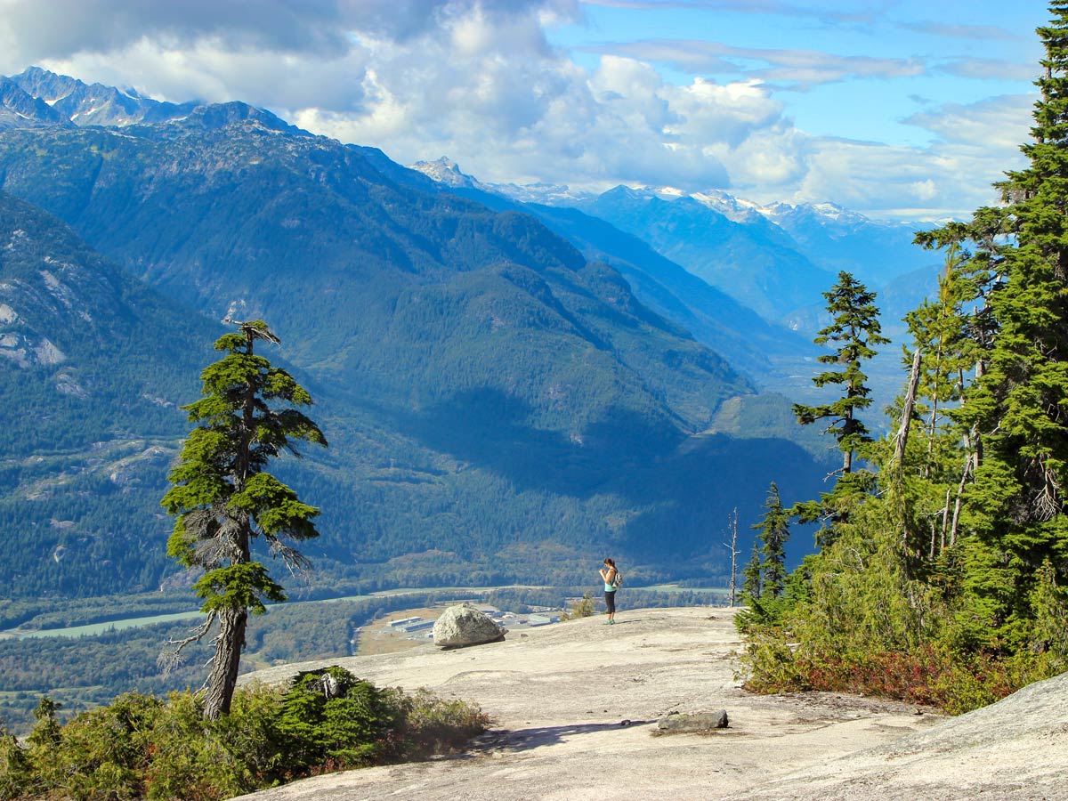 Hiker stands on Als Habrich Ridge near Squamish BC