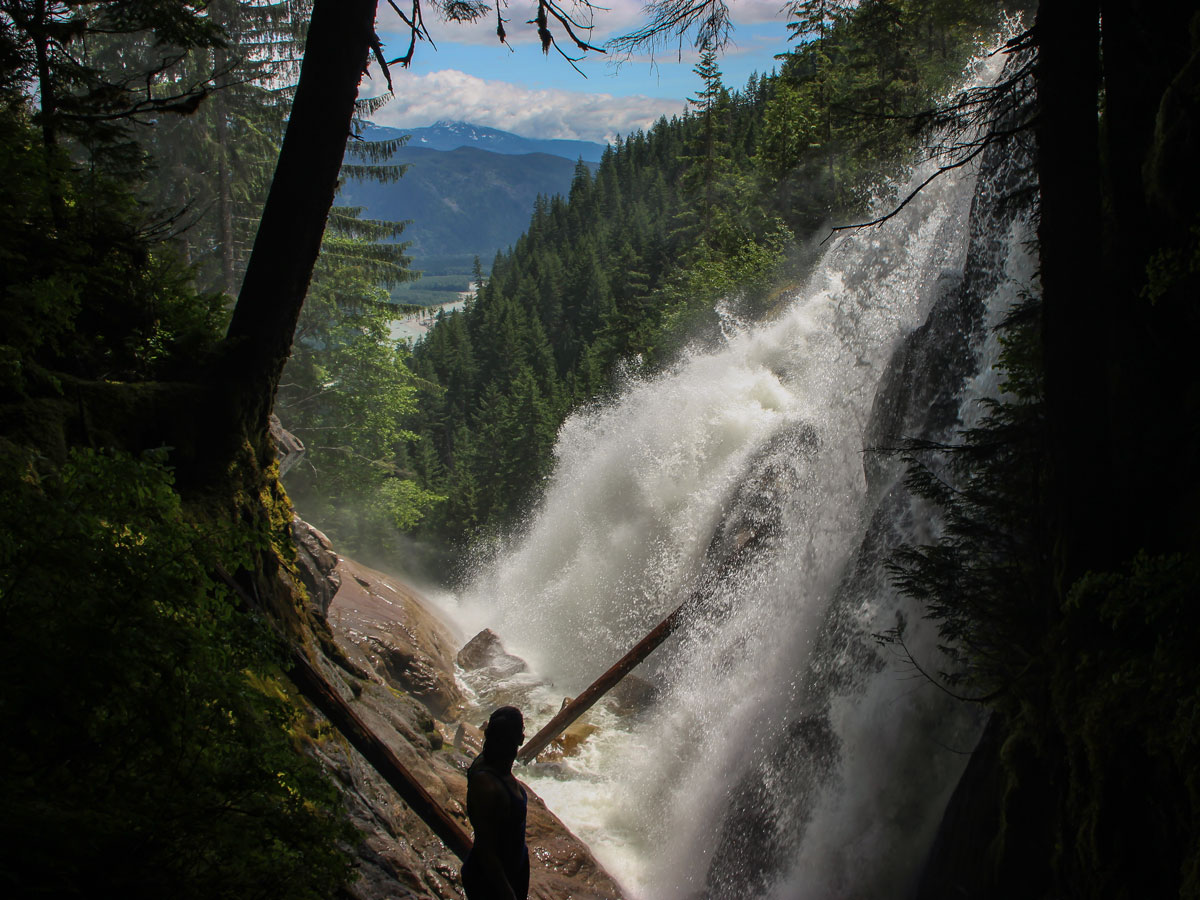 Hiker standing next to Crooked falls near Squamish BC