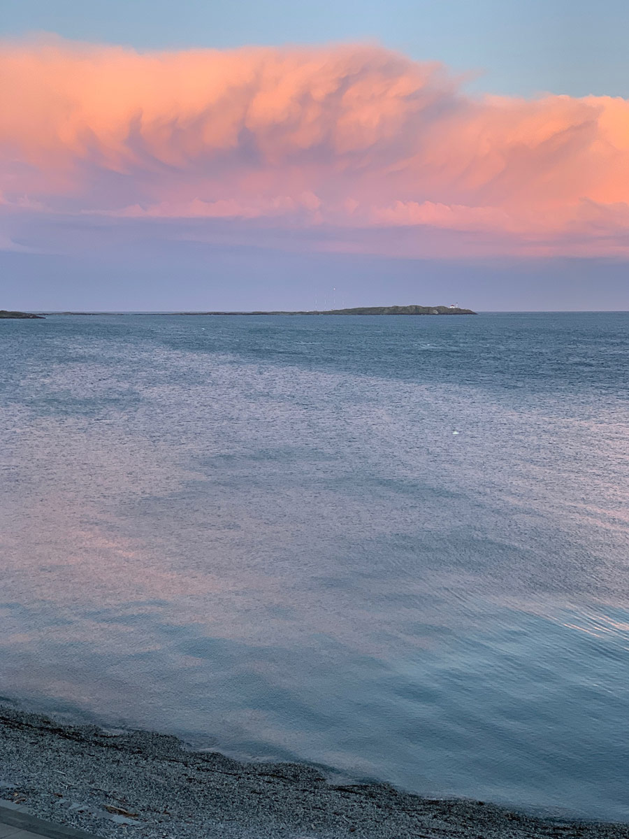 Beautiful sunset and clouds over calm ocean hiking at Ogden Point near Victoria