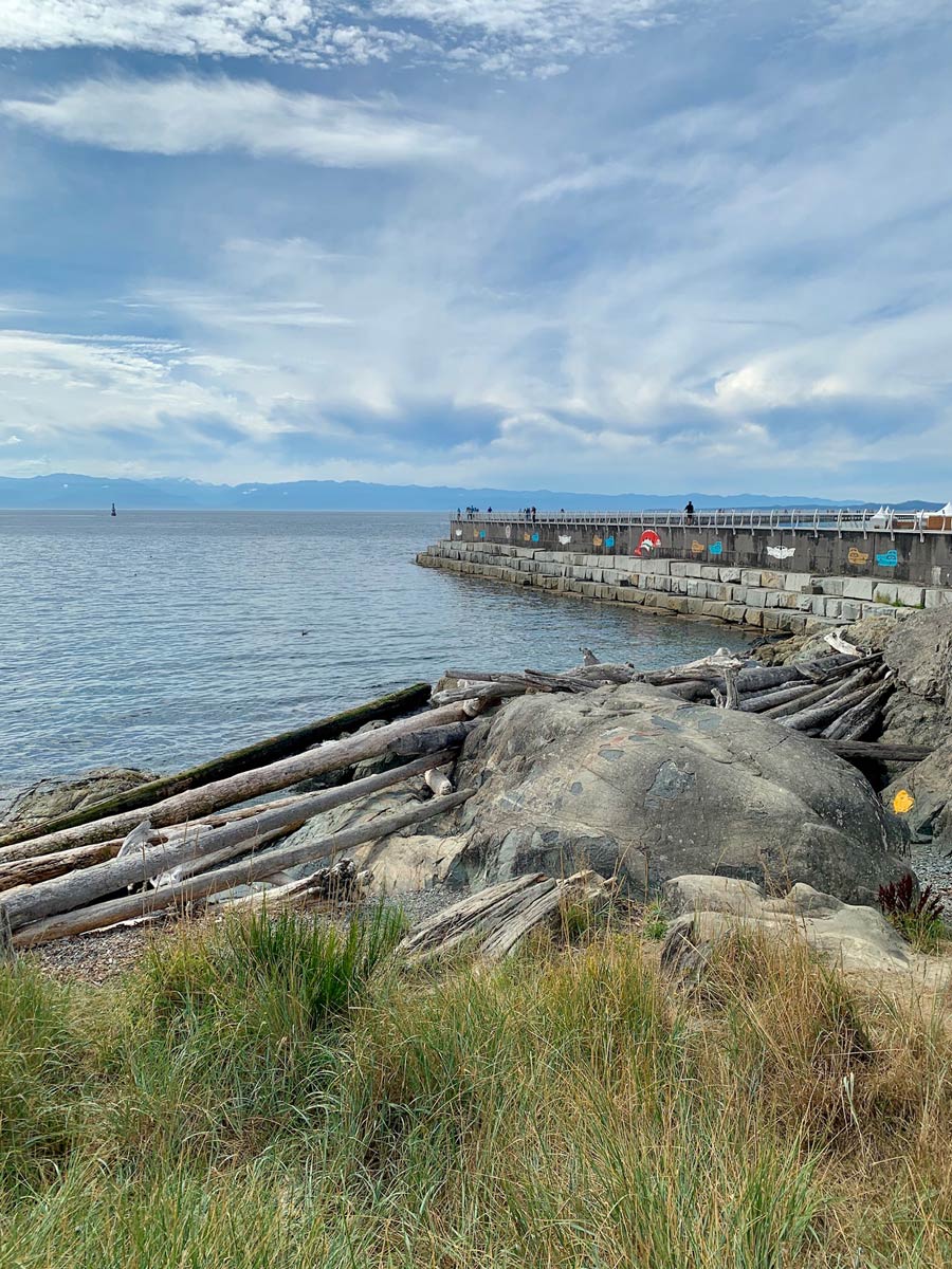 Dock extends from shore at Ogden Point on one of the best hiking trails around Victoria
