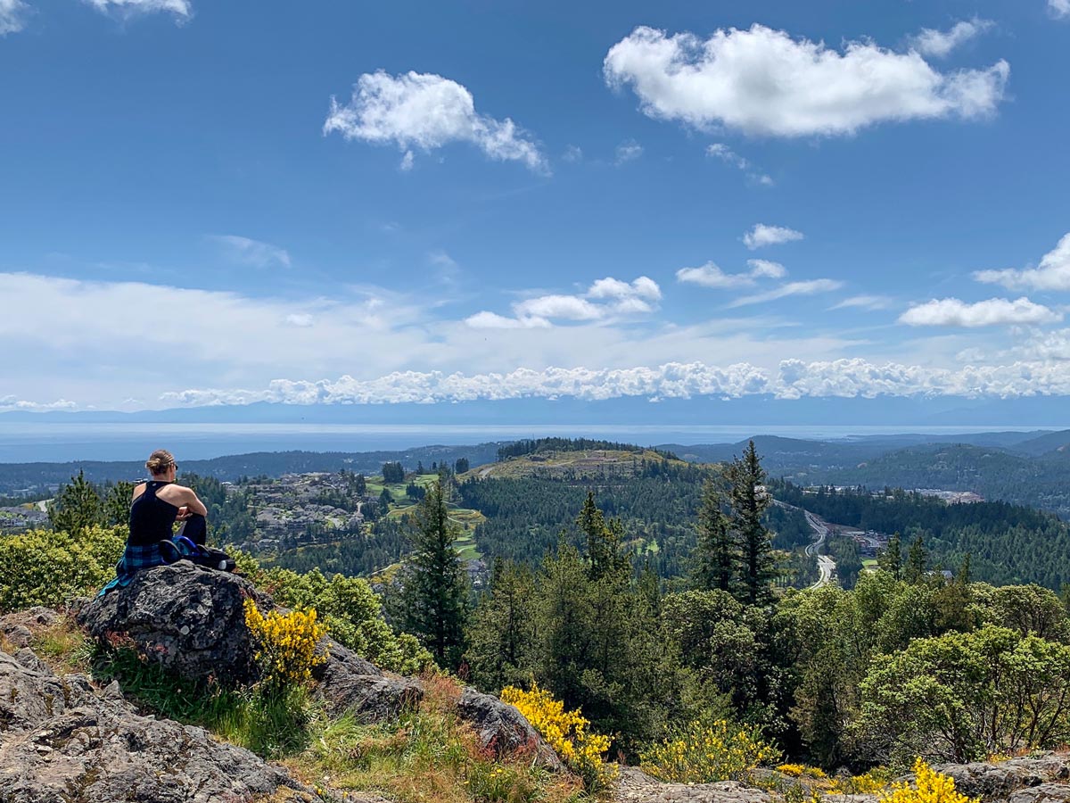 Hiker looks out on Vancouver Island from Mount Finlayson near Victoria