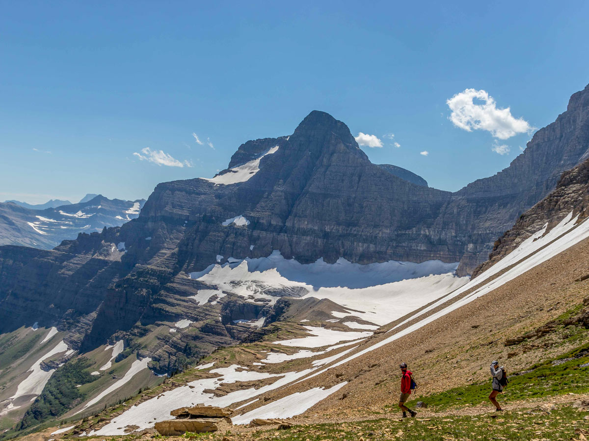 Two hikers on beautiful Siyeh Pass trail