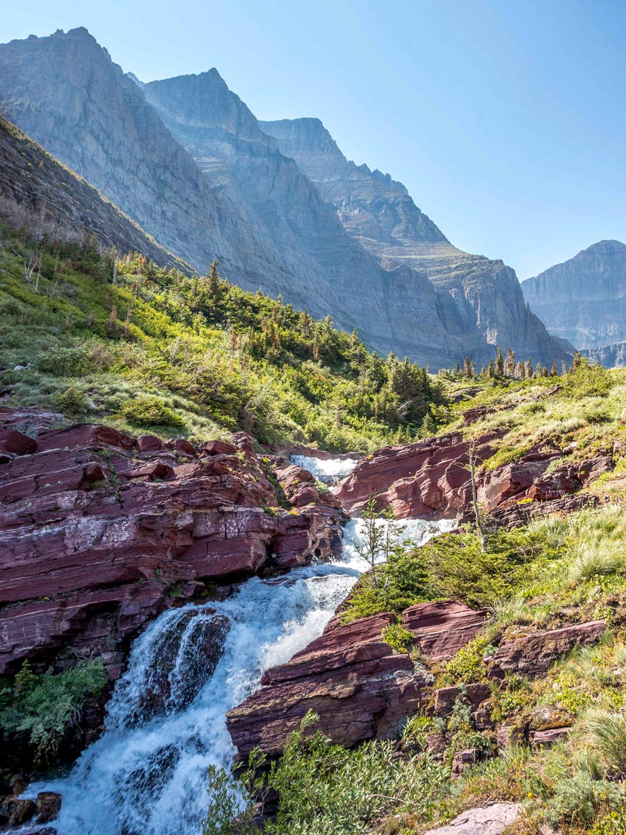 Beautiful mountain waterfalls along Siyeh Pass trail