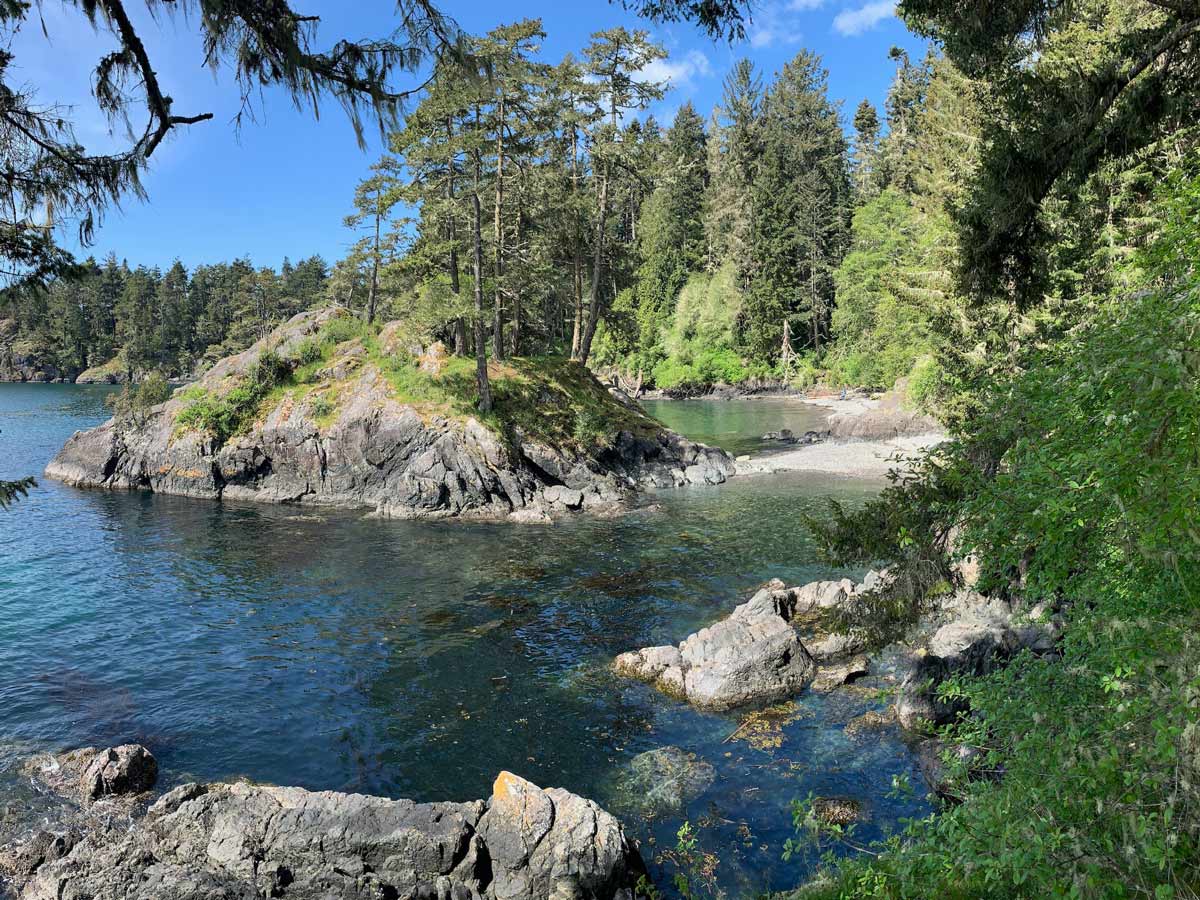Clear ocean waters viewed from amazing hiking trail in Sooke near Victoria