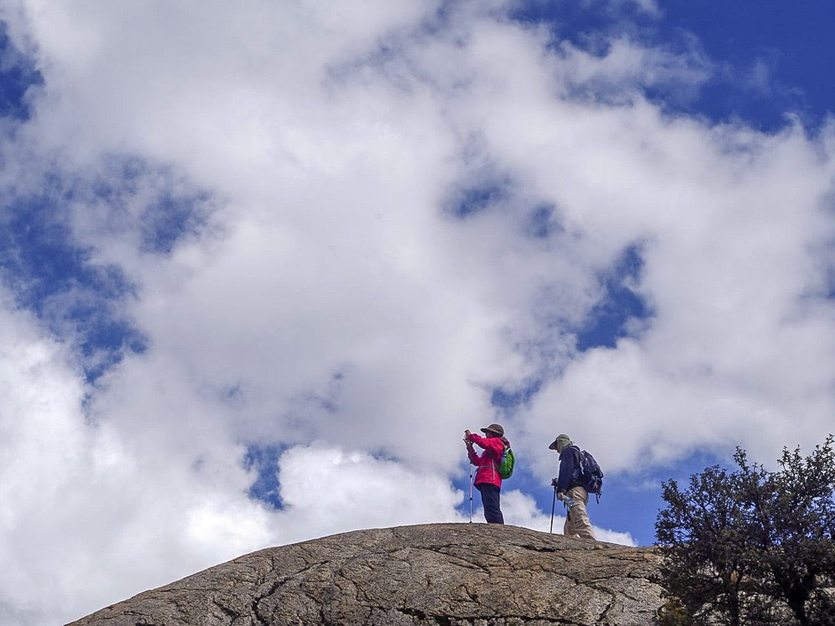 Hikers taking photos near lake Churup