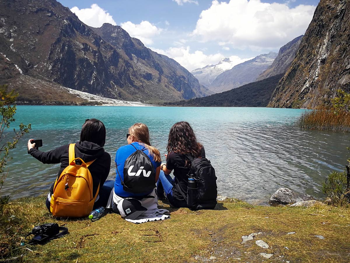 Hikers take photos by Portachuelo De Llanganuco