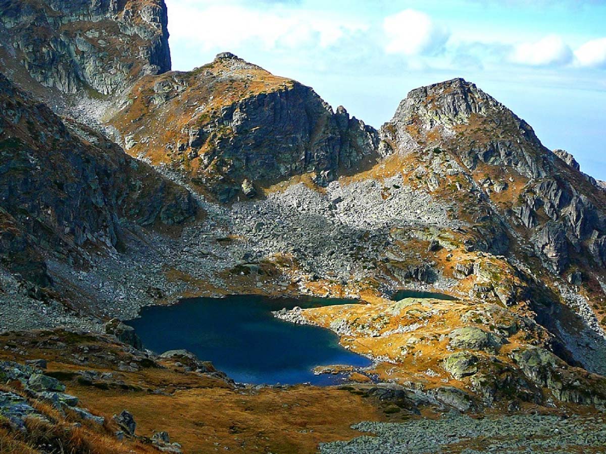 Deer lake and the vertical North face of Malyovitsa in Bulgaria