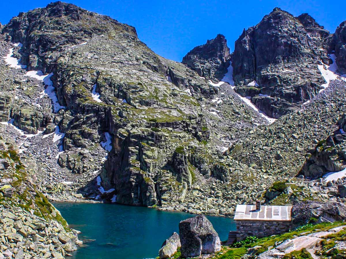 View with the Scary lake the shelter and the Kupeni peaks behind