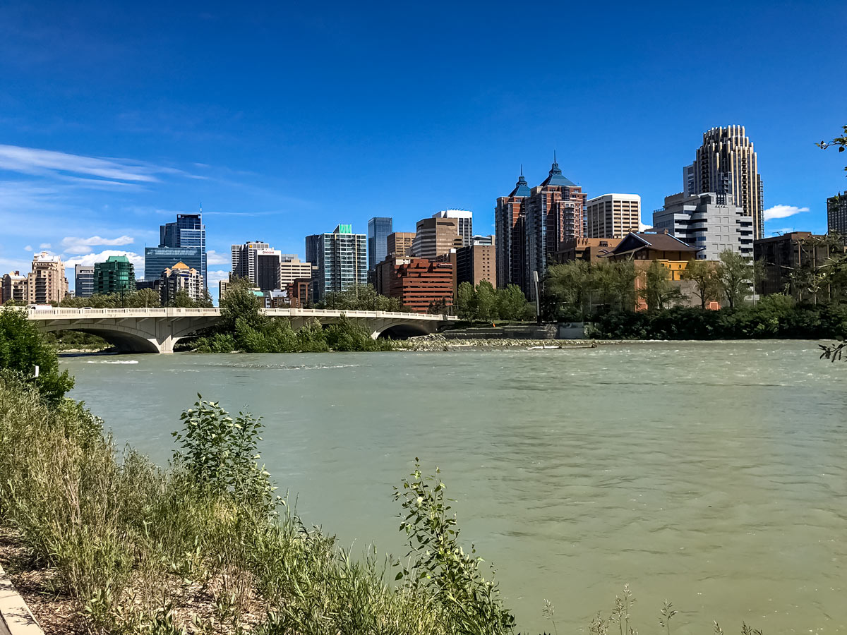 Bow river flowing alongside Calgary downtown seen from bike trail from South Calgary to Edworthy