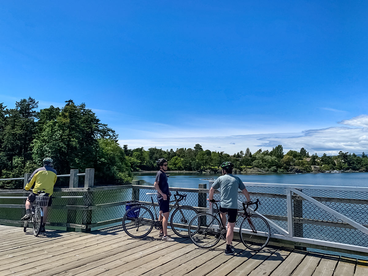 Bikers stop on bridge along trail from Galloping Goose to Thetis Lake trail near Victoria