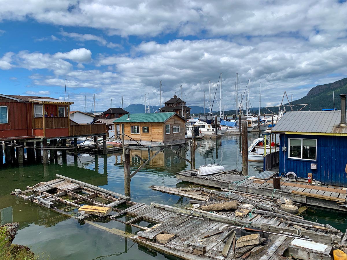 Houseboats and boat houses in Mill Bay seen biking Mill Bay to Cowichan Valley near Victoria