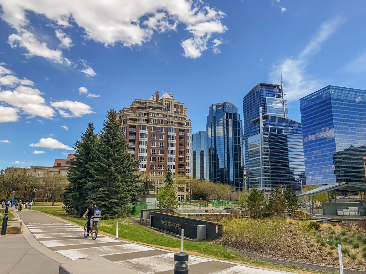 Cycling past beautiful downtown Calgary along cycling trail from Bow Rvier Pathway to Bowness in Calgary Alberta