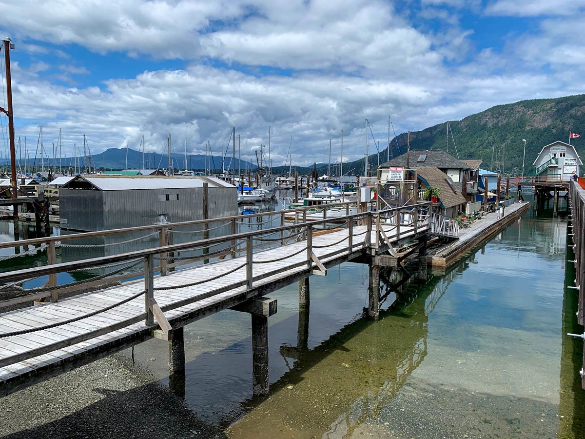 Beautiful boat houses on the ocean s shore seen biking Mill Bay to Cowichan Valley near Victoria