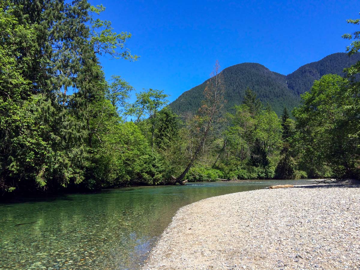 Calm turtouise river by Gold Creek Falls near Vancouver BC