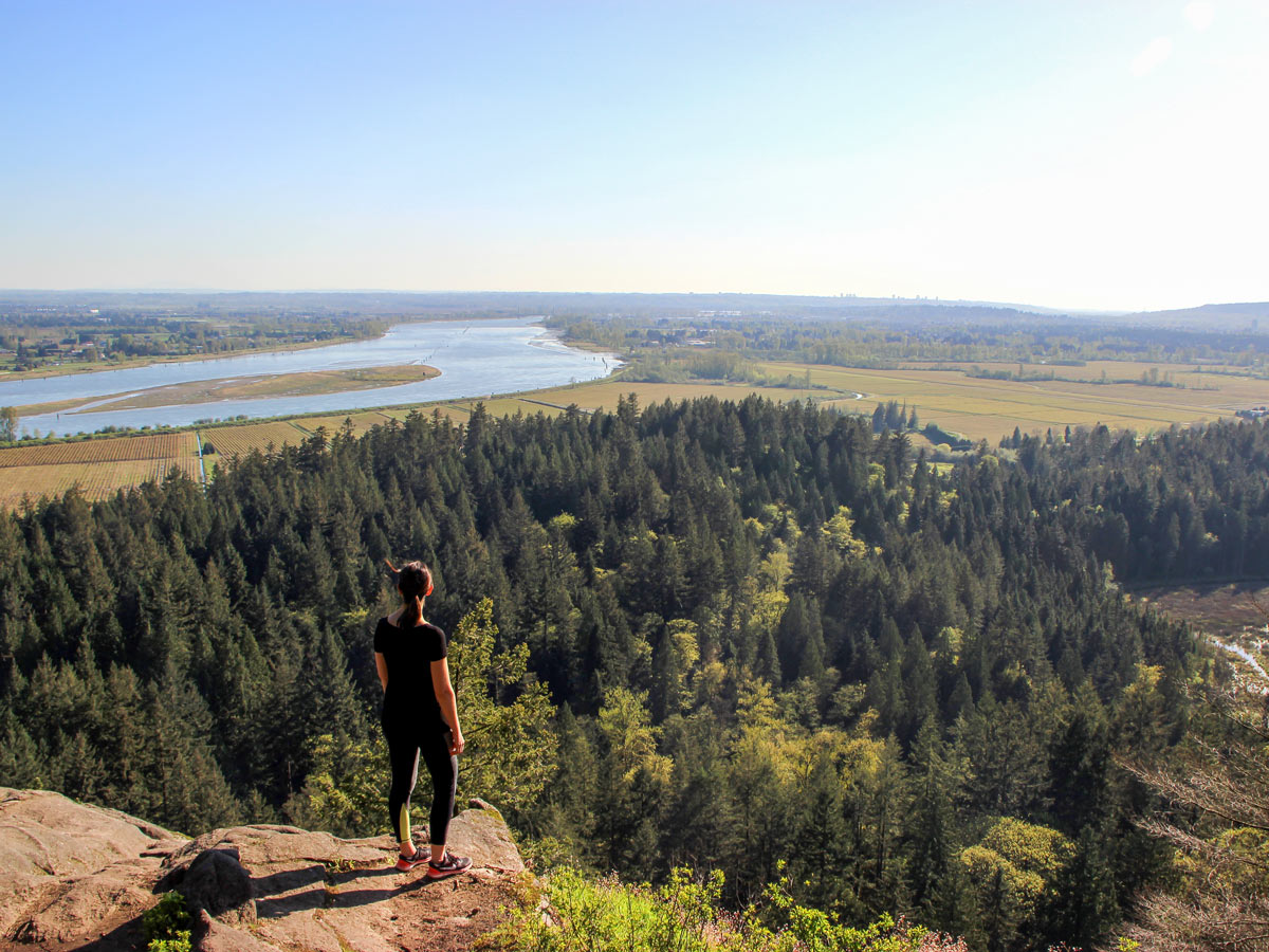 Hiker admires view from High Knoll lookoutnear Vancouver